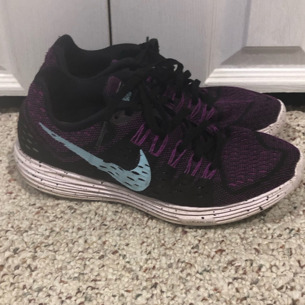 Nike women’s size 8 purple and black shoes.